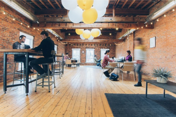 Photo of a coworking space with people at their computers.