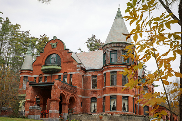 Wilson Castle, a historic red brick castle with turrets and a parapet. 